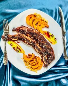 Short Ribs on a plate with delicata squash