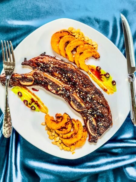 Short Ribs on a plate with delicata squash