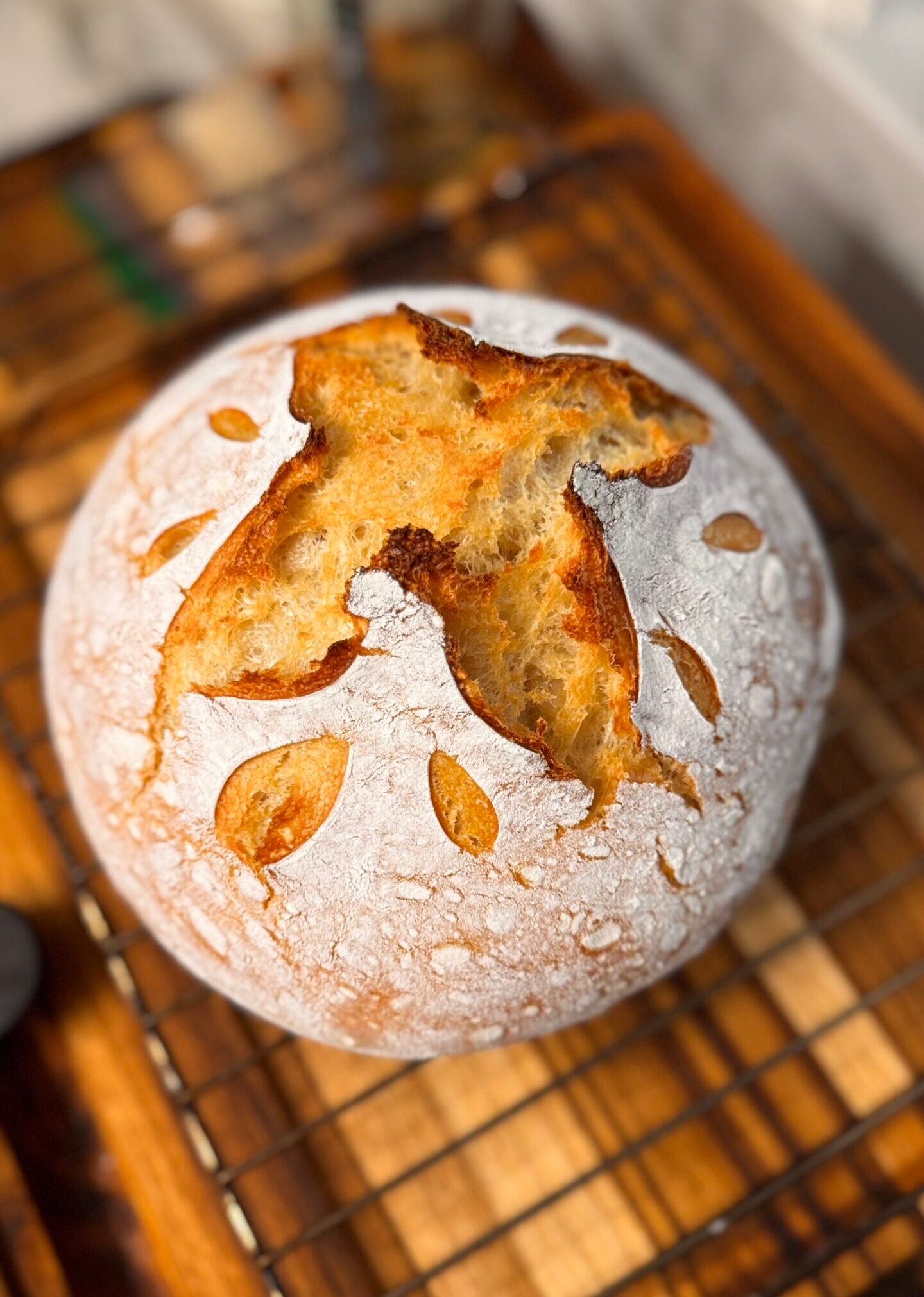 sourdough bread loaf on wooden cutting board